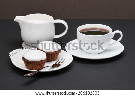 Cupcakes With Cocoa And White Cream. Coffee And Milk.