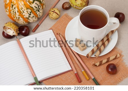 Opened Notebook. Cup Of Hot Tea With Sweets. Natural Linen Table Cloth.