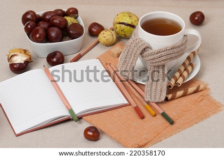 Opened Notebook. Cup Of Hot Tea With Sweets. Natural Linen Table Cloth.