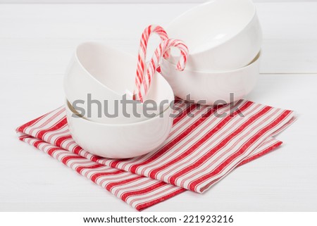 Christmas Candy Cane. White Bowls. Red White Napkin.