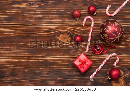 Christmas Decorations. Gift Box. Candy Canes. Wooden Background.