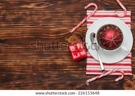 Kitchenware On Striped White Red Cotton Napkin. Gift Box. Christmas Decoration. Candy Canes. Wooden Background.