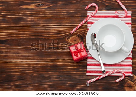 Kitchenware On Striped White Red Cotton Napkin. Gift Box. Candy Canes. Wooden Background.