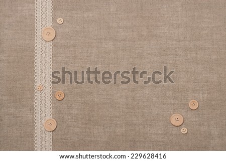 Natural Linen Textile With Lace Ribbon And Wooden Buttons.