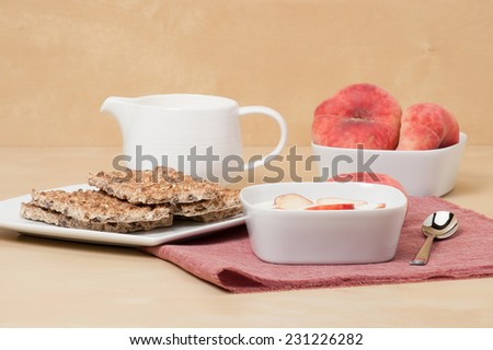 Healthy Breakfast. Fresh Peaches With Low Fat Yogurt. Crisp Bread. Natural Linen Napkin.