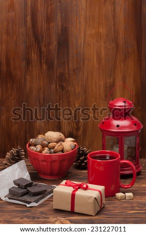 Mug Of Tea Or Coffee. Sweets And Spices. Bowl Of Nuts. Christmas Decorations. Wooden Background.