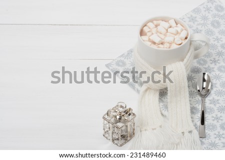Mug Of Hot Chocolate With Scarf. Marshmallows. Christmas Decorations. Space for Text.