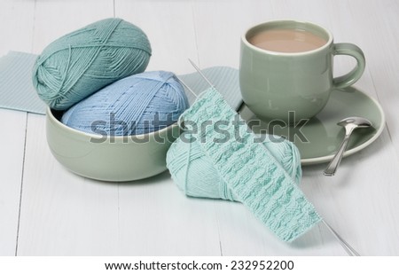 Knitting Accessories. Yarn Balls. Knit Needles. Cup Of Hot Drink. Old Silver Spoon.