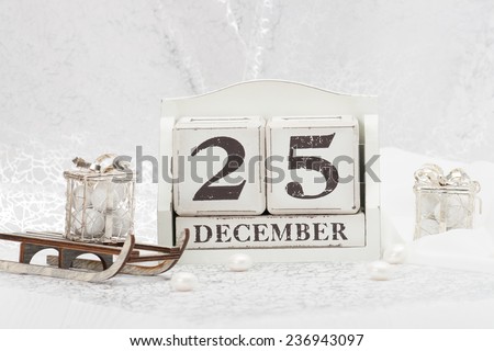 Christmas Day Date On Calendar. December 25. Christmas Decorations. Gift Box On Sleigh. Sweets.