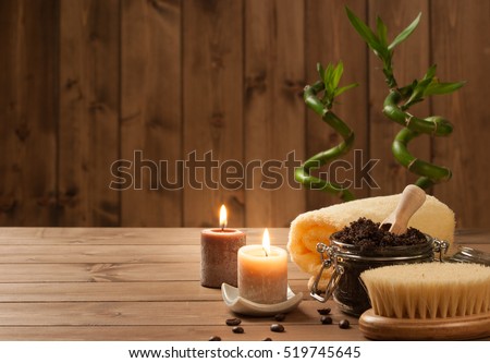 Handmade Coffee Scrub With Argan Oil. Burning Candles. Decorative Bamboo Shoots. Spa Room