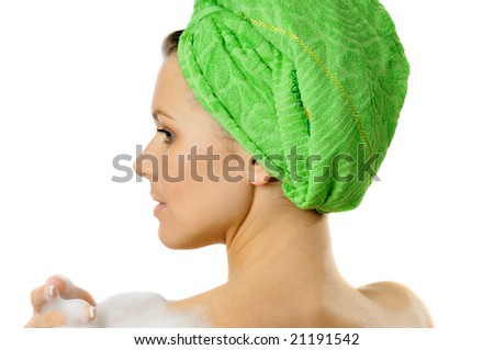 Portrait of beautiful girl with towel on head turned back, isolated on white