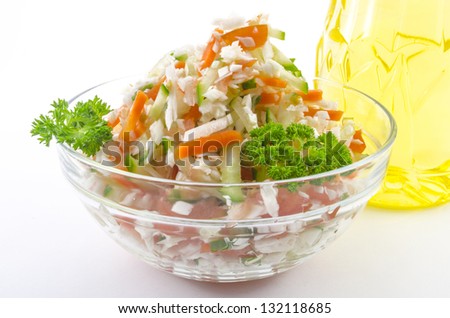 vegetarian salad of cabbage, carrot, tomato and cucumber seasoned with vegetable oil