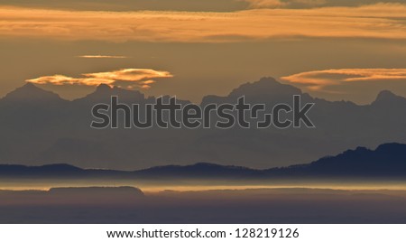 Sunrise of sun on the mountain range of the Alps