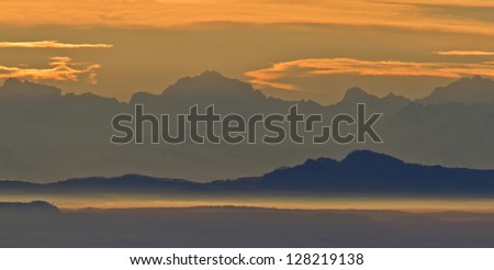 Sunrise of sun on the mountain range of the Alps