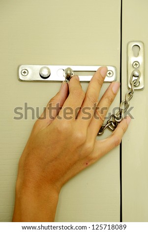 Locking up or unlocking door with hinge in hand