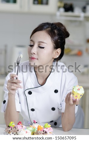 Asian female chef in chef whites uniform