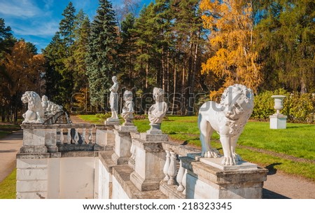 Antique sculptures on the terrace in the autumn park