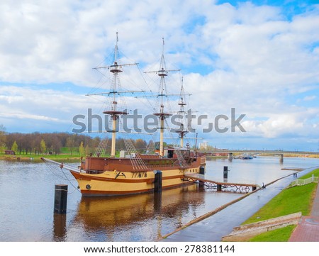 Ancient sailing ship stands near the city waterfront