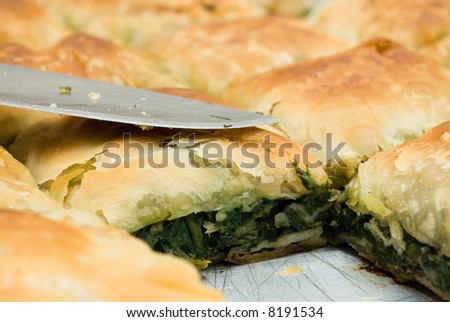 stock-photo-traditional-spinach-pie-and-a-knife-from-greece-8191534.jpg