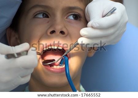 Young boy at the dentist\' s chair