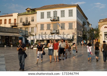 NAFPLIO, GREECE - JULY 26: Tourists are walking on Plateia Syntagmatos (Constitution Square) on July 26, 2006 in Nafplio, Greece. Nafplion was the first capital city of Greece.