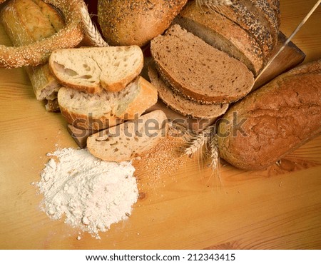 bakery background - breads, flour, wheat ears, seeds
