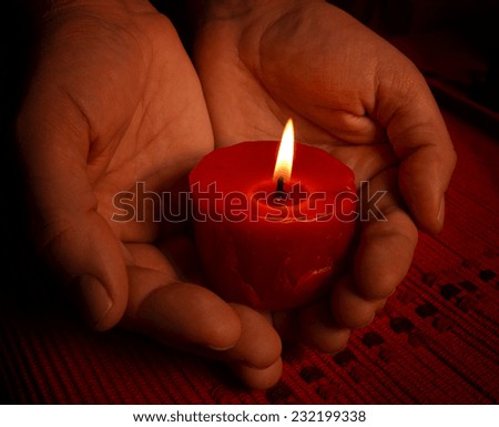 red candle hands in the dark