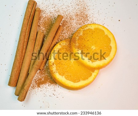 cinnamon rolls and powder - orange slices - space to put your text - background