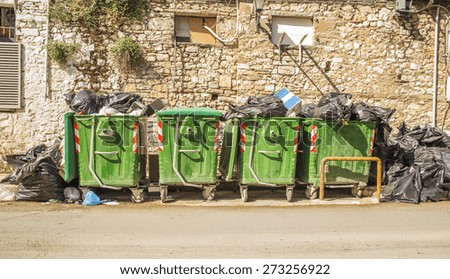 litter bins green full - black bags
