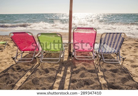 beach sun beds colorful - before sunset- Preveza beach Greece