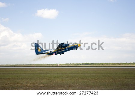 Punta Gorda, Fl.- March 21:The U.S. Navy's C-130 Hercules cargo support aircraft for the Blue Angels uses 8 rockets to assist a short take off at the Florida International Airshow on March 21-22, 2009