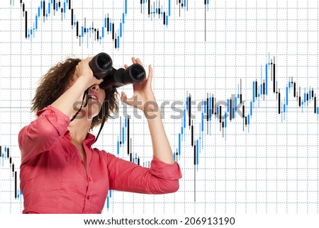 Modern business woman looking. Woman holding a pair of binoculars and looks forward to the background of the financial schedule. Advertising concept for an insurance company or bank financial market.