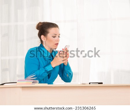 Sad woman emotionally talking on mobile phone. Telephone calls. She office employee or department head. Talking on the phone with a client about the affairs of the business. Answer the call. Message.