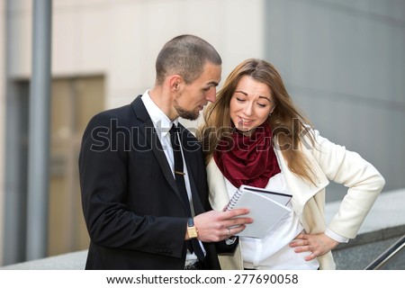 Business man and woman talks of the project contract. Modern business partners having meeting. Business people. Young business couple meeting. Business meeting. Meet the client. Business communication