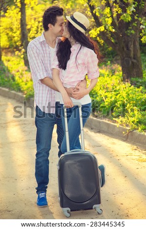 Young couple in love traveling. Road, countryside, together, together - aim to go on vacation. Love story and lifestyle - concept of the relationship between two people. Man and woman. Wedding Trips.