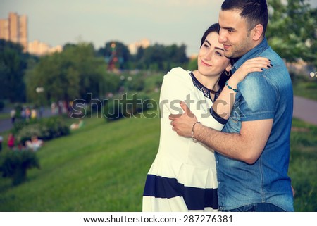 Love Story. Love story man and woman embracing each other. A couple in love. They are looking forward to one another. Young happy family together. They are Arab or Asian origin. Multinational couple.