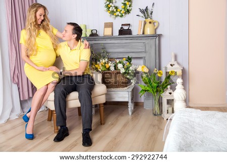 Pair of husband and wife. Woman is pregnant, they are expecting a baby together. Couple of happy people. Happy family in anticipation of the birth of the baby. Woman on the ninth month of pregnancy.