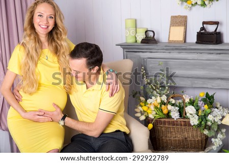 Pair of husband and wife. Woman is pregnant, they are expecting a baby together. Couple of happy people. Happy family in anticipation of the birth of the baby. Woman on the ninth month of pregnancy.