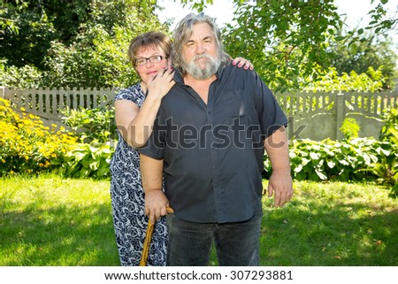 Happy and smiling old couple. Elderly seniors couple in park. Beautiful happy old people. Very adult man and woman.