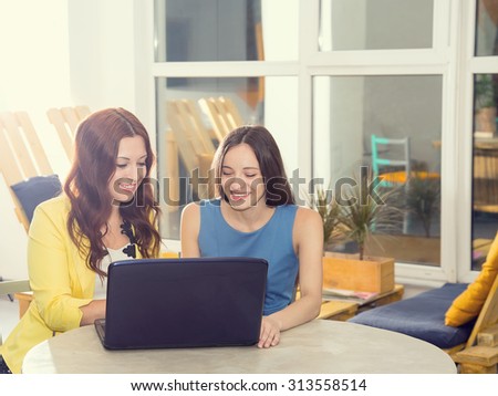 Interview. Two female students and young office workers. Meeting, discussion, joint work on the project. Staff of the office of women in the room for training. Two women working at the laptop computer
