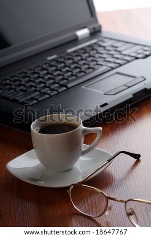 Business theme with laptop and coffee