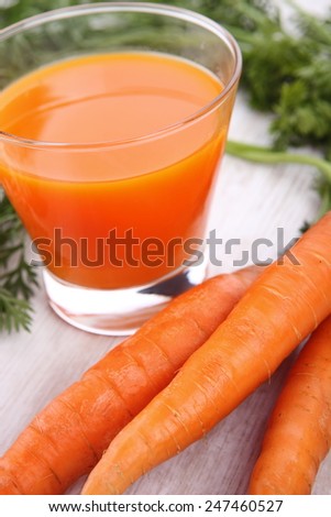 Fresh healthy carrot juice on white background