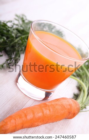 Fresh healthy carrot juice on white background