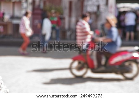 Blur woman ride motorcycle