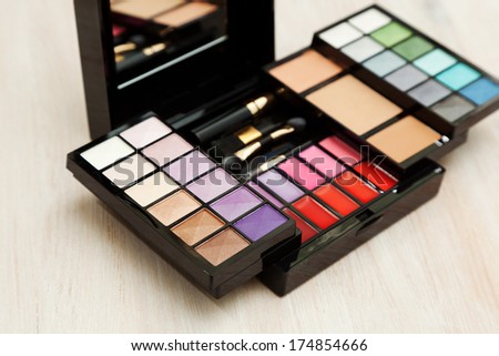 Set of cosmetics for the face. Set of eyeshadow, powder, brushes