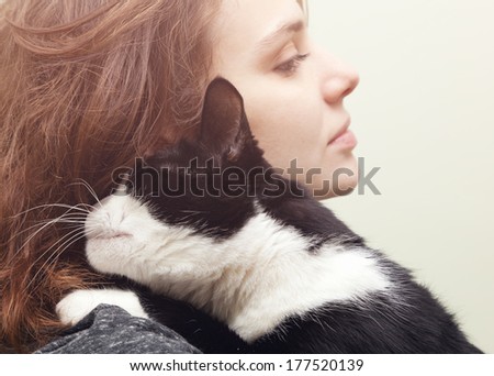 beautiful young woman 20 years  with monochrome black and white cat