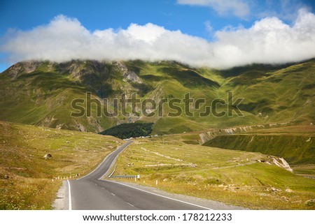 winding road in the mountains in summer
