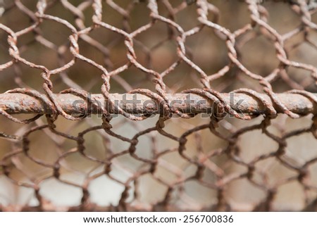texture of rusty iron fence wire, with selective focus