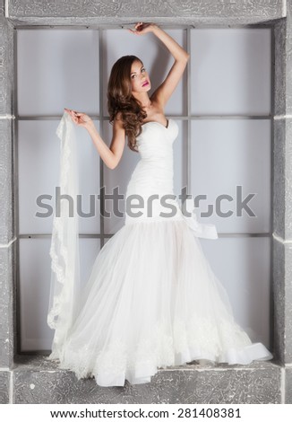 beautiful girl in a wedding dress, studio shooting