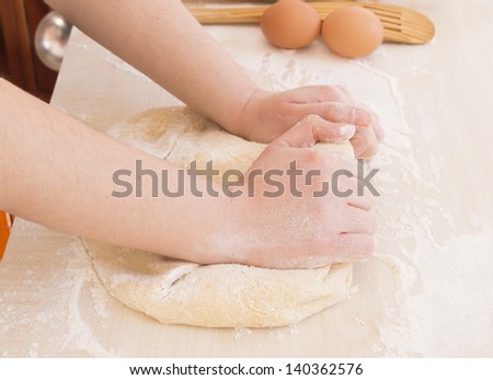 hands kneading bread cooking dough